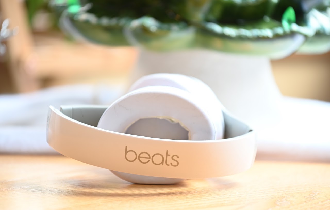 Rear view of folded white Beats Studio2 headphones