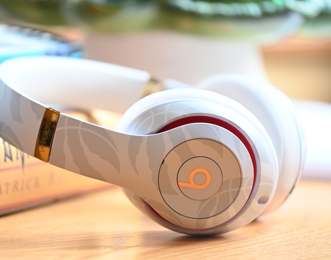 Folded white Beats Studio3 headphones viewed from the side