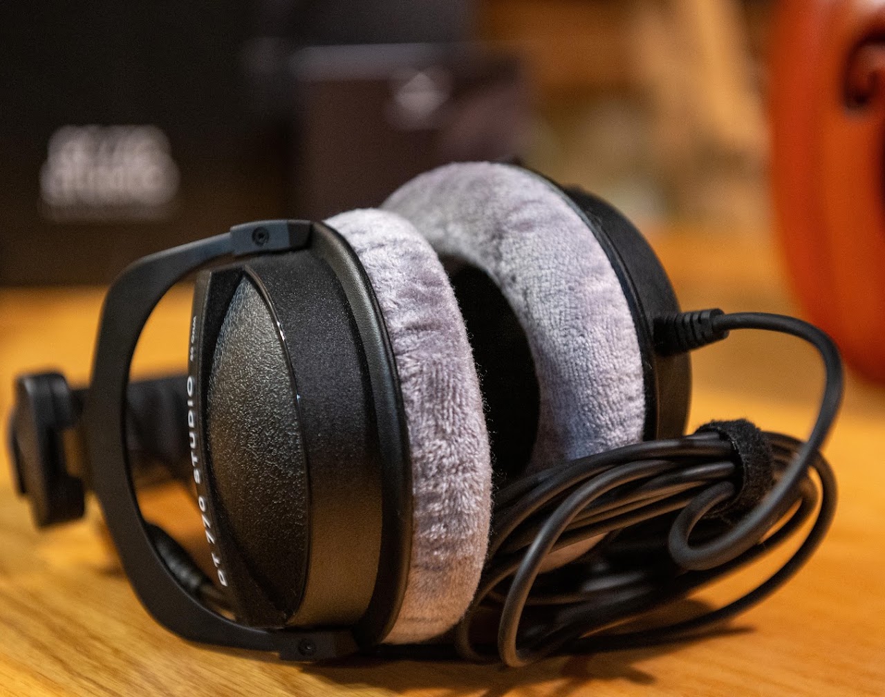 Folded Beyerdynamic DT 770 headphones with their fixed cable