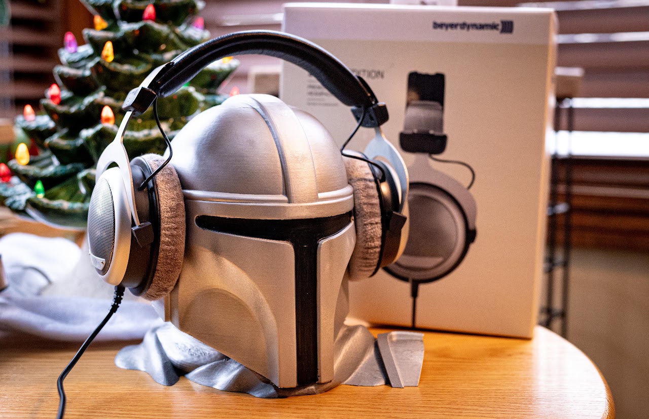 Beyerdynamic DT 880 headphones on a display helmet