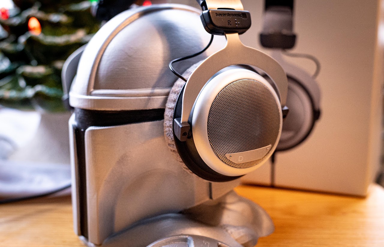 Side view of Beyerdynamic DT 880 headphones on a display helmet
