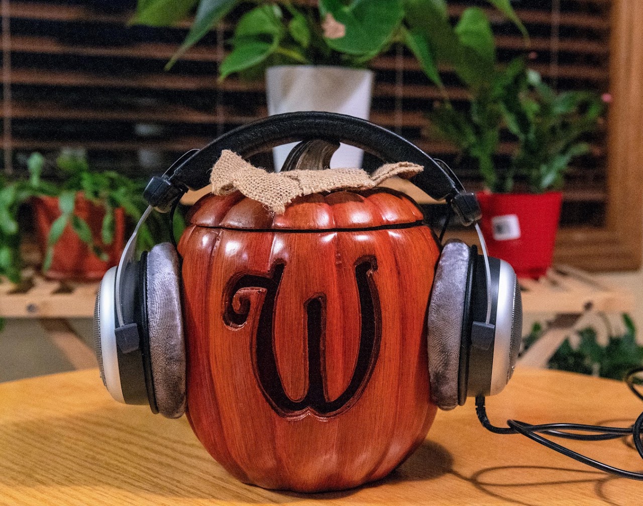 Beyerdynamic DT 880 headphones on a carved wooden head display