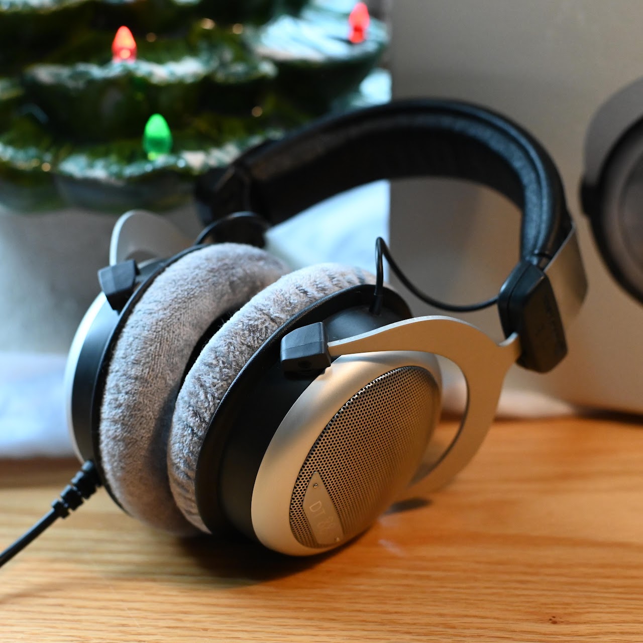 Beyerdynamic DT 880 headphones arranged on a wooden table