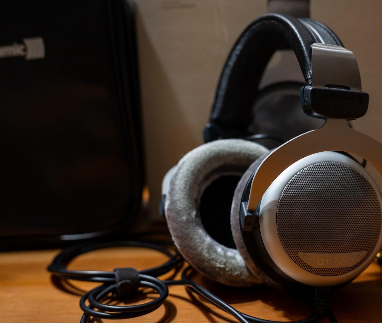 Beyerdynamic DT 880 headphones beside their carrying case