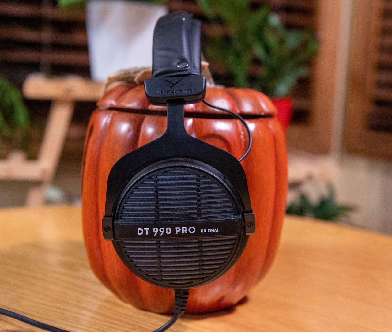 Rear view of Beyerdynamic DT 990 Pro headphones on a wooden display