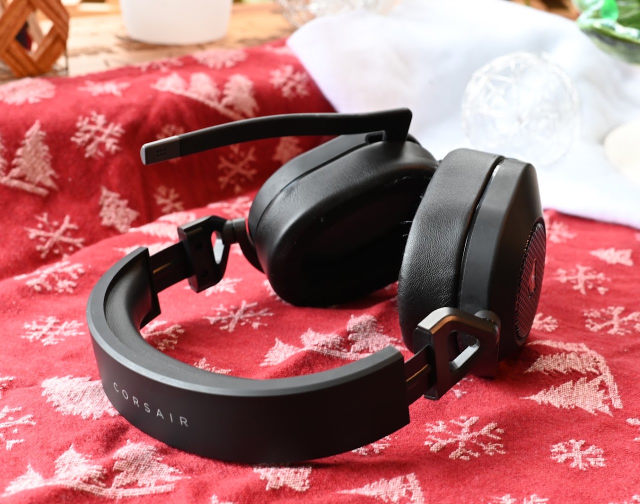 Corsair HS65 headset folded on a red patterned cloth