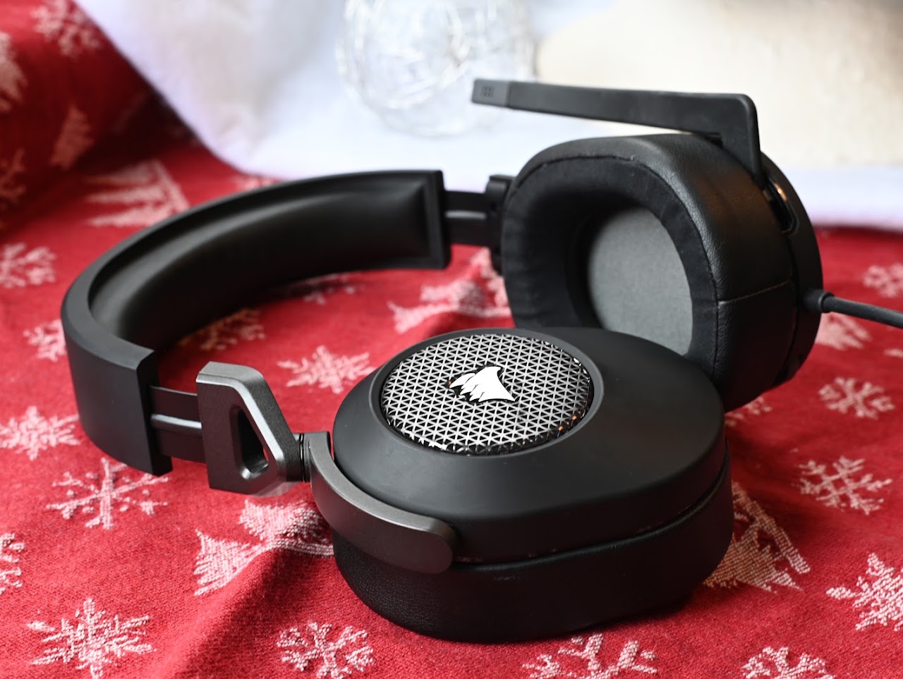 Corsair HS65 headset opened on a red patterned cloth