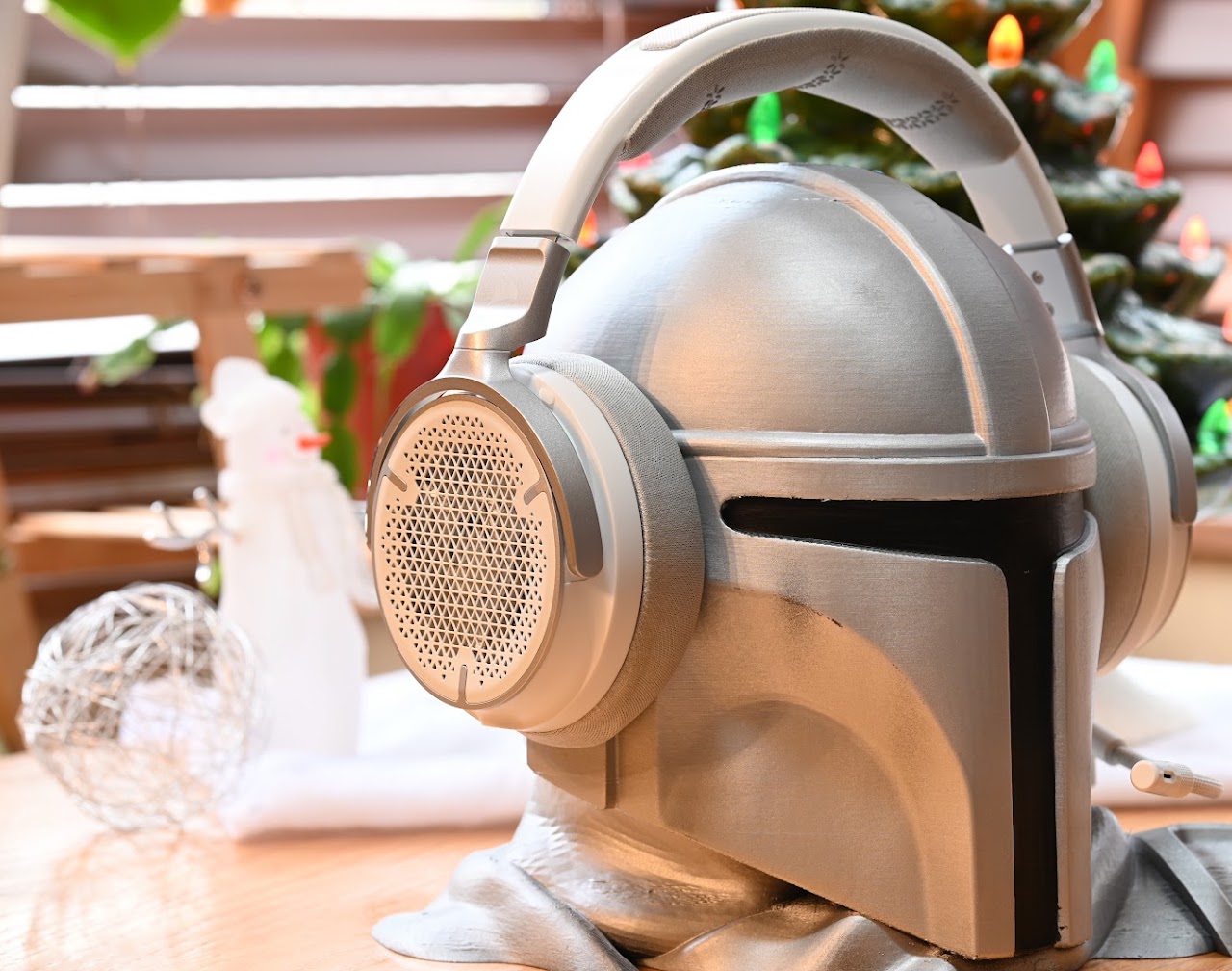 White Corsair Virtuoso Pro headset on a display helmet