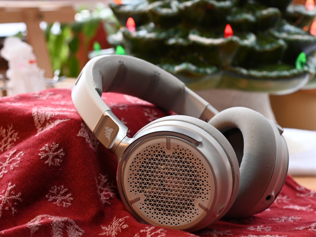 White Corsair Virtuoso Pro headset on a red patterned cloth
