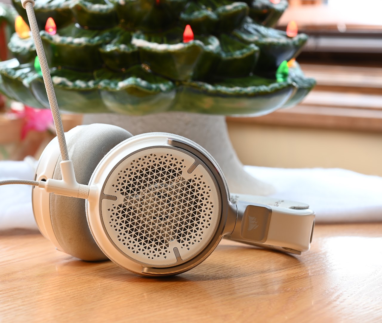 Side view of a white Corsair Virtuoso Pro headset