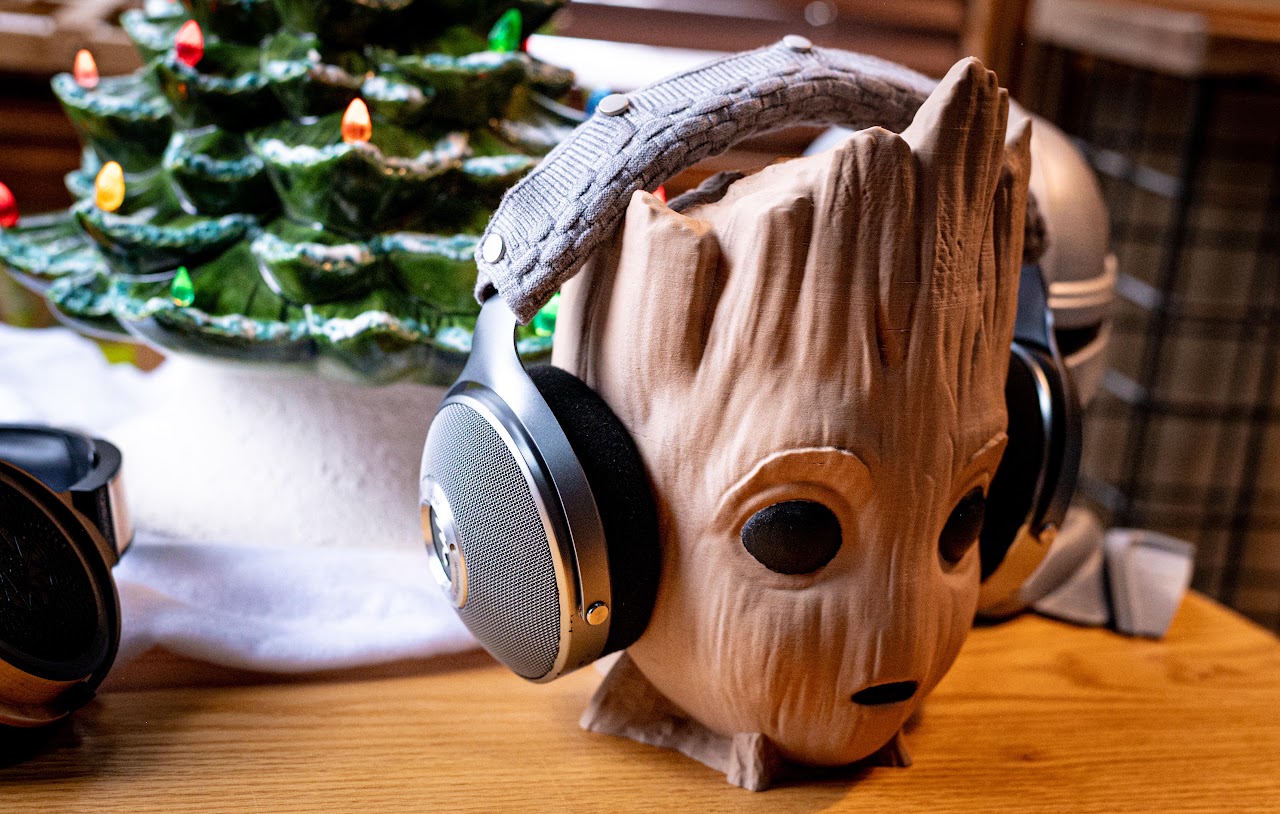 Focal Clear headphones on a carved wooden head display