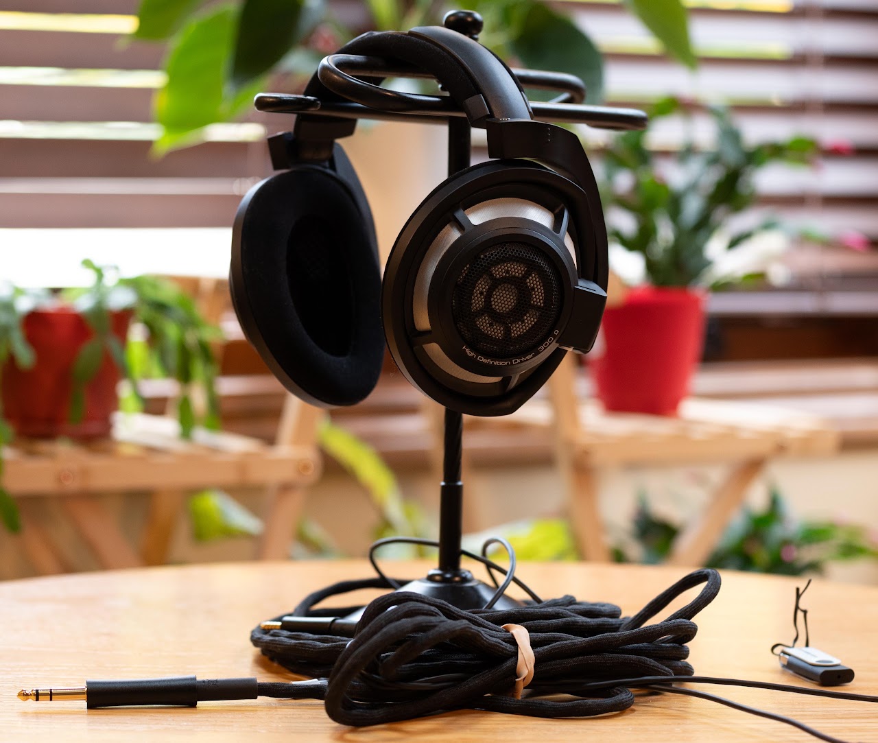 Sennheiser HD 800 S headphones on a stand with their cable